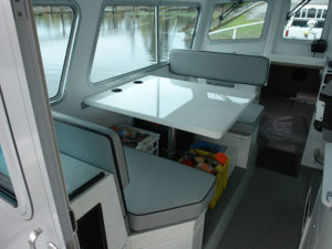 4 person settee (40") drop down table, storage cupboards, & vinyl upholstered seating incl. backrest cushions