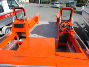 Dual consoles with windshield, storage and steering